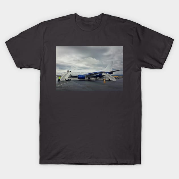 plane boarding T-Shirt by psychoshadow